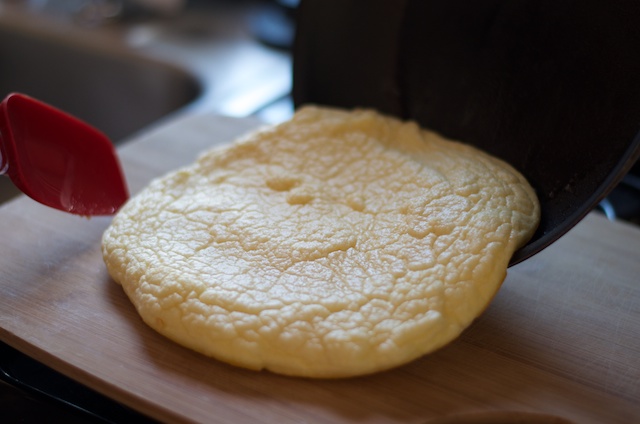 sliding omelette onto cutting board